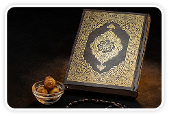 Stack of Qur'ans with prayer beads